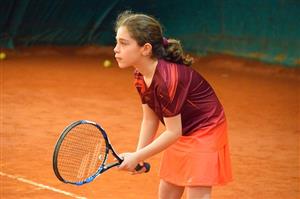 Young Girl Playing Tennis